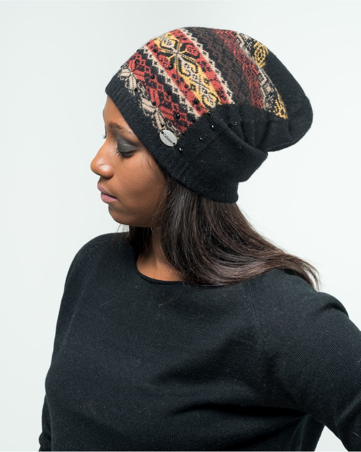 Cappello Rap jacquard con punti luce. Realizzato in lana merino